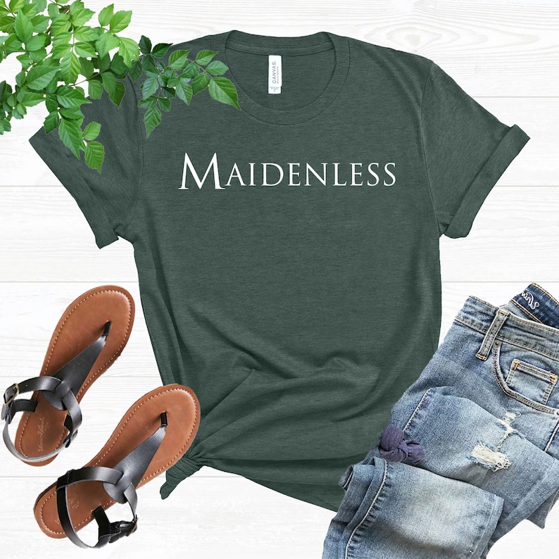 May include: A dark green t-shirt with the word "MAIDENLESS" printed in white on the front.
