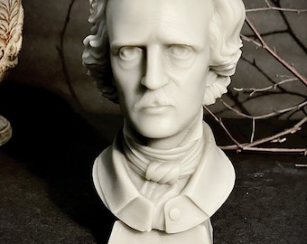 May include: A white candle shaped like a bust of a man with a moustache and a tie. The candle sits on a small white base.