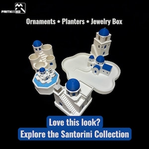 May include: A collection of white and blue Santorini-themed ornaments, planters, and a jewelry box. The designs feature iconic blue-domed buildings and white structures. Text on the image reads: "Ornaments &bull; Planters &bull; Jewelry Box" and "Love this look? Explore the Santorini Collection."