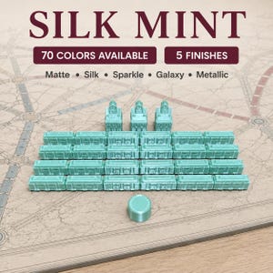 May include: A set of mint green board game pieces including three station buildings, twenty-four train cars, and one round marker. Text on the image reads SILK MINT, 70 COLORS AVAILABLE, 5 FINISHES, Matte, Silk, Sparkle, Galaxy, and Metallic.