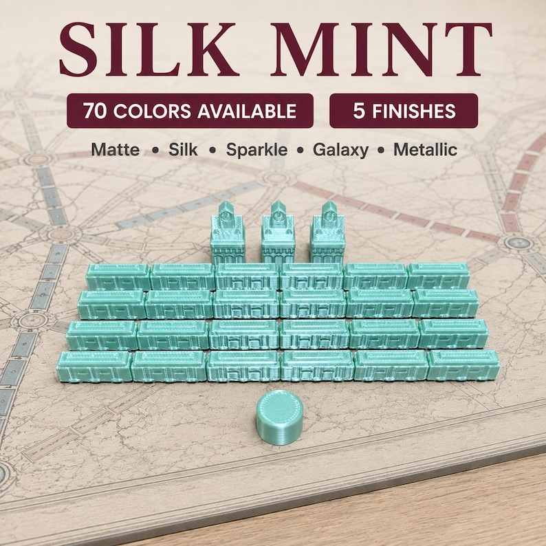 May include: A set of mint green board game pieces including three station buildings, twenty-four train cars, and one round marker. Text on the image reads SILK MINT, 70 COLORS AVAILABLE, 5 FINISHES, Matte, Silk, Sparkle, Galaxy, and Metallic.
