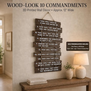 May include: A brown wall hanging featuring the Ten Commandments printed in white text on ten horizontal slats connected by rope. The piece is labeled as 3D printed wood-look decor and measures approximately 12 inches wide with hanging hardware.