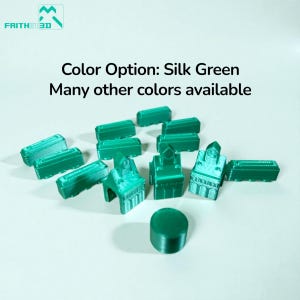 May include: A collection of small, silk green 3D printed game pieces including rectangular blocks, building-shaped tokens with peaked roofs, and a single circular disc. Text reads: Color Option: Silk Green. Many other colors available.