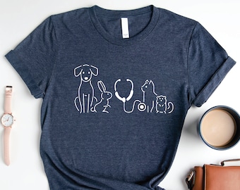 May include: A dark blue t-shirt with a white graphic of a dog, rabbit, cat, and a stethoscope. The graphic is a simple line drawing.