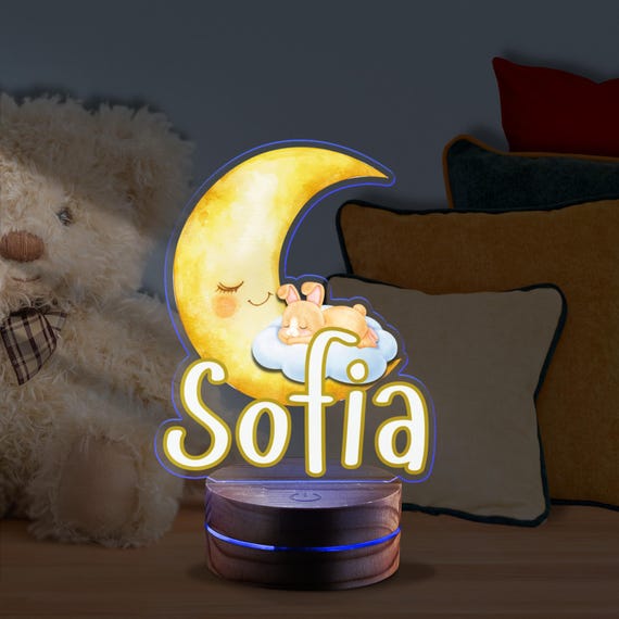 Newborn Baby Sleeping Peacefully On Crescent Moon Under Starry Sky Surrounded By Dreamy Night Clouds 319910440