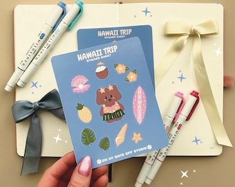 May include: A sticker sheet with a blue background featuring a cartoon dog wearing a lei and holding a surfboard. The sticker sheet also includes other Hawaiian-themed images such as a pineapple, a seashell, and a coconut. The text "HAWAII TRIP STICKER SHEET" is printed on the sticker sheet.