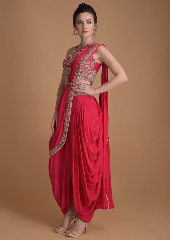 Red embroidered asymmetrical layered top with overlap dhoti pants available  only at Pernia's Pop Up Shop. 2024
