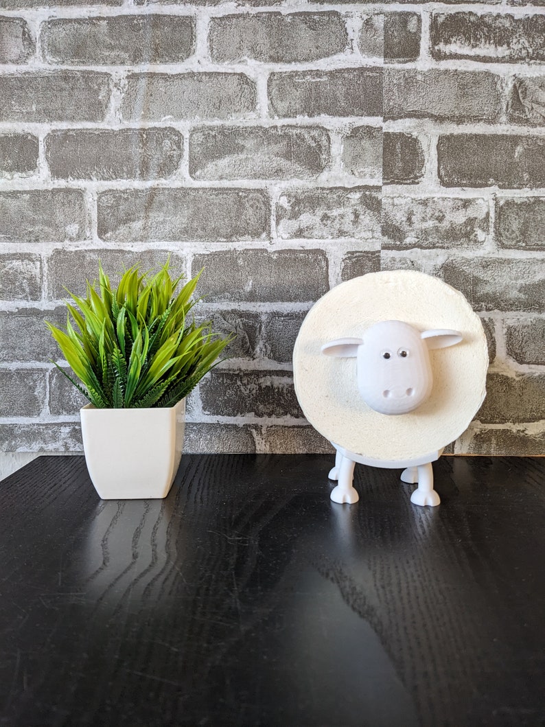 Ein Toilettenpapierhalter Schaf in weiß