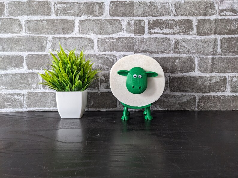 Ein Toilettenpapierhalter Schaf in grün