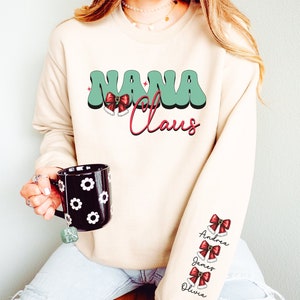 Custom Nana Claus Christmas Sweatshirt with Grandkids Names Personalized Gigi Christmas Sweatshirt Grandma Christmas Gift Mimi Sweatshirt