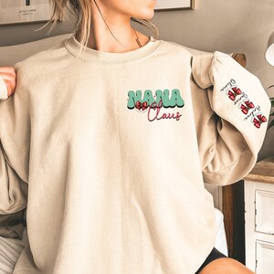 Custom Nana Claus Christmas Sweatshirt with Grandkids Names Personalized Gigi Christmas Sweatshirt Grandma Christmas Gift Mimi Sweatshirt