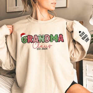 Custom Grandma Claus Christmas Sweatshirt with Grandkid Names Personalized Gigi Christmas Sweatshirt Nana Christmas Gift Mimi Sweatshirt