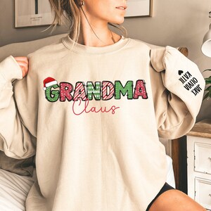 Custom Grandma Claus Christmas Sweatshirt with Grandkid Names Personalized Gigi Christmas Sweatshirt Nana Christmas Gift Mimi Sweatshirt