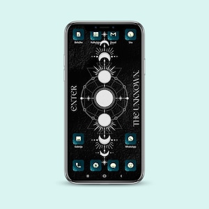 May include: A black smartphone with a dark background and a white geometric design featuring moons and stars. The text "ENTER THE UNKNOWN." is displayed on the right side of the screen. The phone has several app icons, including a calendar, email, gallery, and WhatsApp.