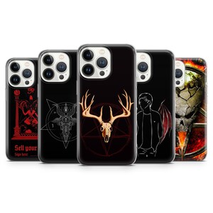 May include: Five different phone cases with various designs. The designs include a skull with antlers, a demon, a pentagram, a silhouette of a person with wings, and a skull with flames.