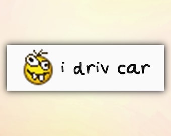 May include: A yellow cartoon face with a wide smile and large eyes, with the text "i driv car" below it.