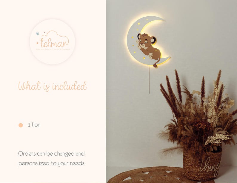 May include: A white crescent moon-shaped wall light with a sleeping lion cub design. The light has a warm glow and is connected to a power source. The image also includes a decorative floral arrangement in a woven basket.