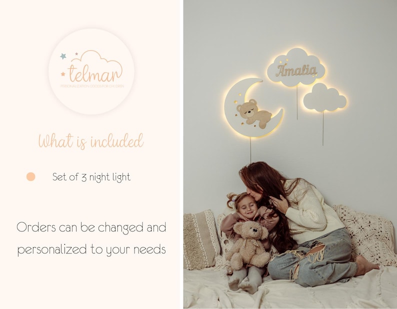 May include: A set of three white wooden night lights shaped like clouds and a crescent moon. The moon features a small brown teddy bear. The cloud with the name "Amalia" is lit up.