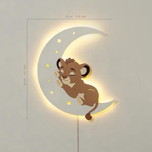 May include: A wall-mounted night light shaped like a crescent moon, 15.7 inches tall and 11.8 inches wide. A cartoon lion cub is nestled on the moon, with small star cutouts. The light has a warm glow and a pull chain.