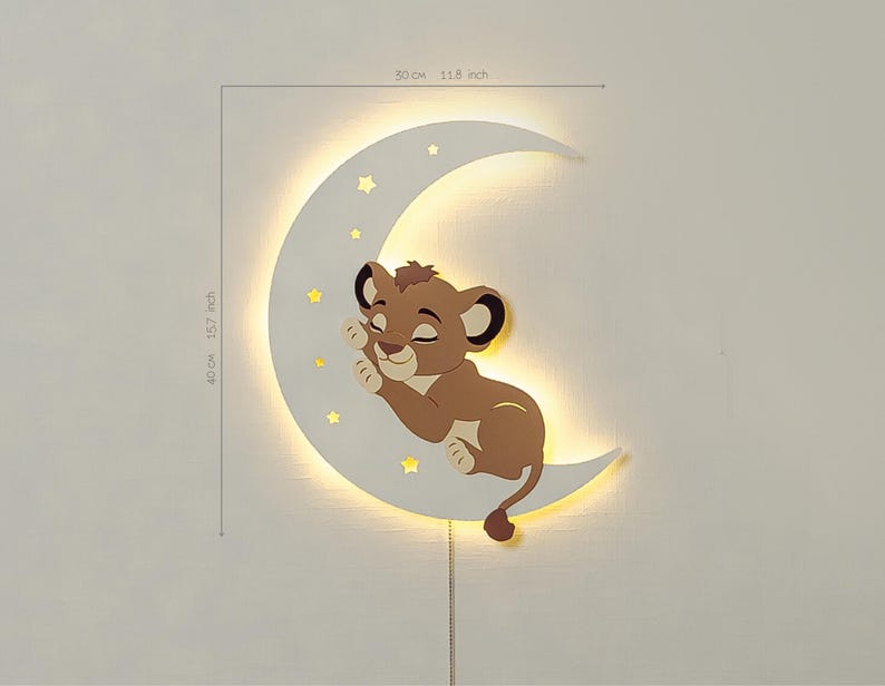 May include: A wall-mounted night light shaped like a crescent moon, 15.7 inches tall and 11.8 inches wide. A cartoon lion cub is nestled on the moon, with small star cutouts. The light has a warm glow and a pull chain.