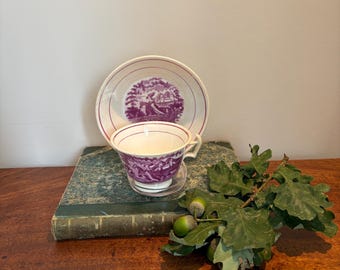 Antique pink Lustre ware tea cup and saucer made in England mid 1800 depicting elegant Lady riding side saddle on her steed.