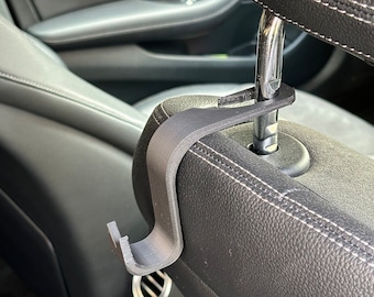 Reposacabezas para asiento de automóvil - Ganchos para bolsos / abrigos (par de)