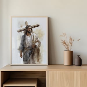 May include: A painting depicting a man carrying a wooden cross on his shoulders. He is wearing a long, flowing robe and has a beard. The background is a soft, watercolour wash of brown and white.