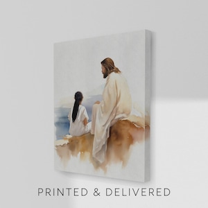 May include: Watercolor painting on canvas depicting two figures in white robes seated on a rock formation. The figures are facing each other, with a serene seascape in the background. The text "PRINTED & DELIVERED" is printed at the bottom.