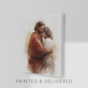 May include: A canvas print depicts a tender embrace between two figures. One figure, in a red robe, embraces another in a white garment. The artwork has a soft, painterly style with warm, neutral tones. The text "PRINTED & DELIVERED" is at the bottom.
