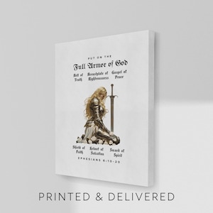 May include: A white canvas print featuring the text "PUT ON THE FULL ARMOR OF GOD" and a kneeling figure in armor with a sword. The print also includes the text "PRINTED & DELIVERED" at the bottom.