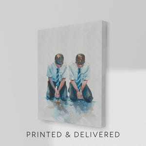 May include: A canvas print featuring a watercolor painting of two figures kneeling. They wear white shirts, blue striped ties, and dark pants. The text "PRINTED & DELIVERED" is printed at the bottom of the canvas.