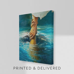 May include: A canvas print depicting a person's hand reaching down to grasp another hand emerging from blue water. The artwork features a realistic painting style with visible brushstrokes. The text "PRINTED & DELIVERED" is printed at the bottom of the canvas.