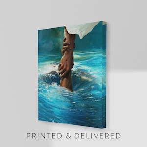 May include: A canvas print depicting a pair of hands reaching out of turbulent blue water, grasping another hand. The artwork features a person in a white garment above the water. The text "PRINTED & DELIVERED" is printed at the bottom.