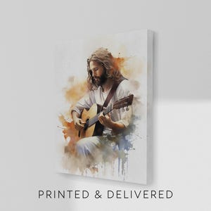 May include: A canvas print featuring a watercolor-style depiction of a person playing an acoustic guitar. The image has a soft color palette with warm tones and the text "PRINTED & DELIVERED" at the bottom.