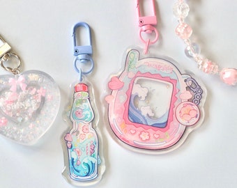 Ramune Tamagotchi phone charm, Acrylic keychain charm, pink and teal, lanyard, marine sakura, waves