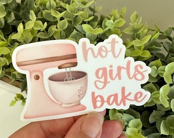 May include: A pink and white sticker with a pink stand mixer and the text "hot girls bake".
