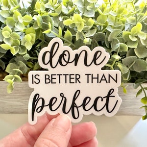 May include: White sticker with black text that reads "done is better than perfect".