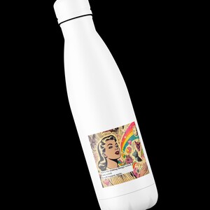 May include: White insulated water bottle with a screw-on cap. The bottle features a colorful sticker with a retro comic book style illustration of a woman, a rainbow, and the text "Sorry for making things weird. I am weird. It will happen again."