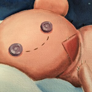 May include: A close-up of a painted teddy bear with button eyes and stitched details. The bear is a light peach color with a red patch and a stitched smile. The background is a dark blue with white accents.