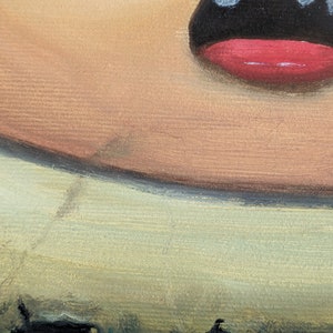 May include: Close-up of a painted portrait of a person's face. The person has a large, open mouth with a red lip and black outline. The skin tone is light brown with a hint of pink. The background is a light green color.