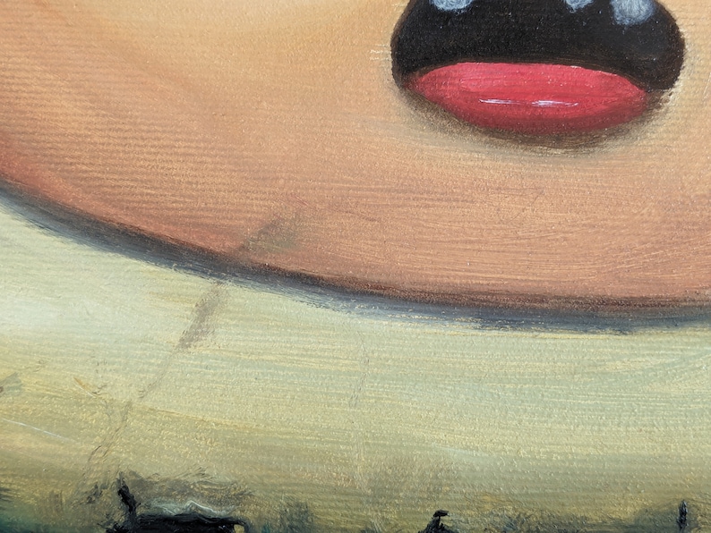 May include: Close-up of a painted portrait of a person's face. The person has a large, open mouth with a red lip and black outline. The skin tone is light brown with a hint of pink. The background is a light green color.