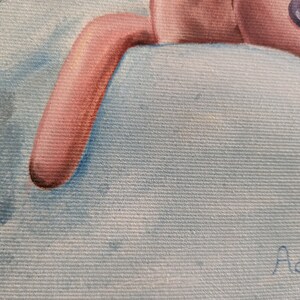 May include: A close-up of a painting featuring a pink stuffed animal with a button eye and a light blue background. The stuffed animal's arm is visible, resting on a light blue surface. The painting has a soft, textured appearance.