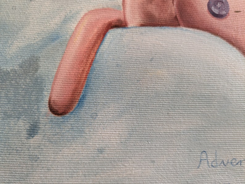 May include: A close-up of a painting featuring a pink stuffed animal with a button eye and a light blue background. The stuffed animal's arm is visible, resting on a light blue surface. The painting has a soft, textured appearance.
