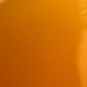 May include: A solid orange background with a slight gradient from light to dark.