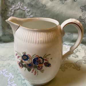 Vintage milk jug with flowers from the 1940s-1960s