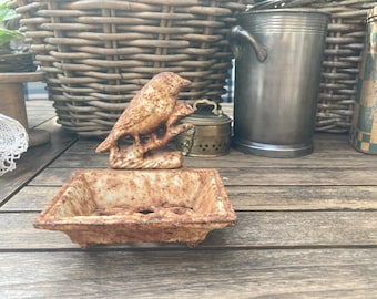 Vintage cast iron soap dish with bird.