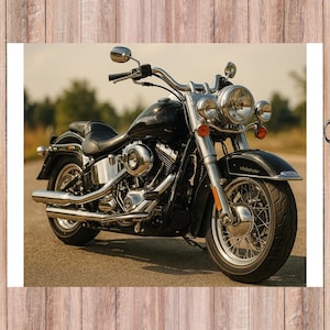 May include: A black Harley-Davidson motorcycle with chrome accents, parked on a paved road. The motorcycle features a large headlight, a curved handlebar, and a black seat. The background shows a blurred green landscape.