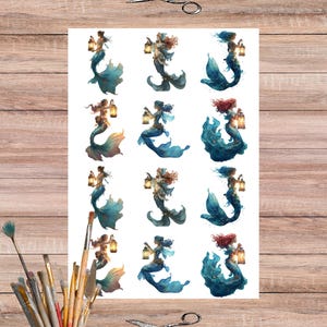 May include: A sheet of mermaid stickers featuring diverse mermaid designs. Each mermaid has flowing hair and a teal or blue tail, holding a lantern. The image is on a white background, with scissors and paintbrushes on a wooden surface.