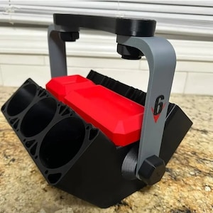 May include: A black and red 3D printed storage organizer with a handle. The organizer has six compartments and a gray handle with the number "6" printed on it.
