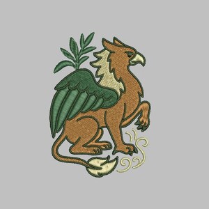 May include: Embroidered design of a griffin, a mythical creature with the body of a lion and the head and wings of an eagle. The griffin is brown with green wings and a beige mane. A sprig of leaves is behind the wing.